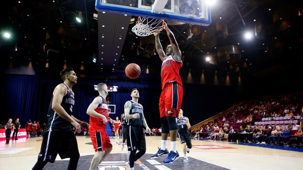 Marvelle Harris dunks for the Hawks during the Australian Basketball Challenge match against Melbourne United.