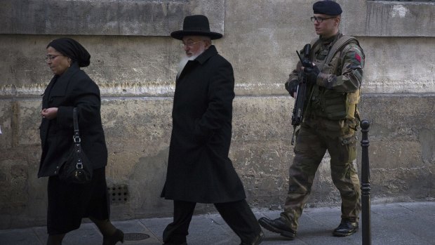 A French soldier patrols near a Jewish school in Paris.