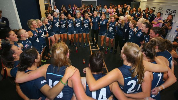 Carlton players celebrate after their win on Friday night. 