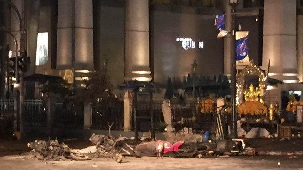 Debris lies on the pavement after the explosion took place near the Erawan Shrine in Bangkok.