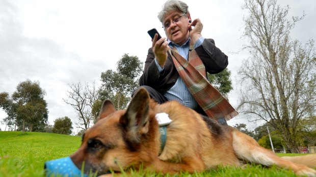 Clinical psychologist Leslie Posen, who uses quantifying apps,  with his dog Shrek, who also wears a GPS tracker.
