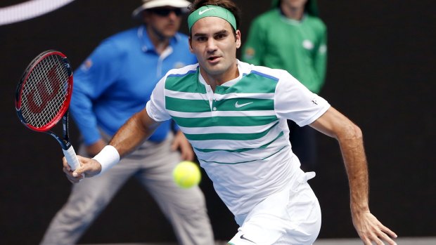 Roger Federer of Switzerland in action against Alexandr Dolgopolov of Ukraine.