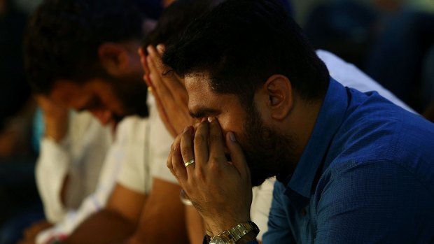 Family and friends attend a 'Condolence Motion' at Brisbane City Hall for Manmeet Sharma.