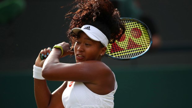 19-year-old Osaka plays a backhand against Venus Williams.