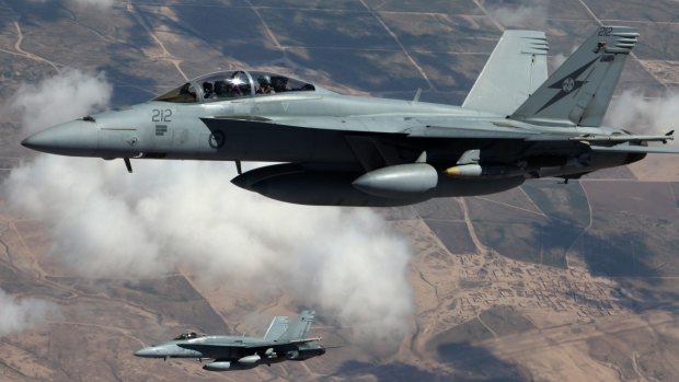 An Australian F/A-18F Super Hornet and an F/A-18A Hornet patrol the skies over Iraq. 