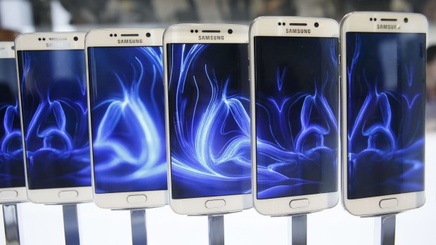 A row of Galaxy S6 edge smartphones on display before the Mobile World Congress in Barcelona.