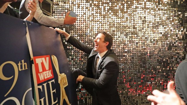 Gold Logie winner Samuel Johnson climbs into the crowd to meet fans at the 59th Annual Logie Awards at Crown.