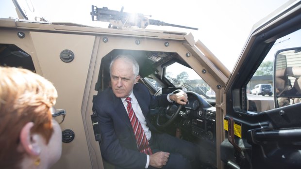 Decisions ... Prime Minister Malcolm Turnbull, right, and Defence Minister Marise Payne, left, inspect new army vehicles earlier this month.