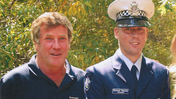 Michael Maynes, pictured with his father Robert Maynes, on his graduation day from Victoria Police.