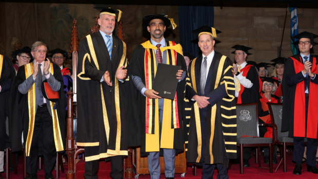 Peter Fitzsimons presents Adam Goodes with an Honorary Doctorate of Health Sciences.