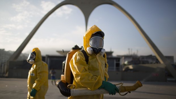 A health worker stands in the Sambadrome as he sprays insecticide to combat mosquitoes that transmit the Zika virus in Rio de Janeiro, Brazil.