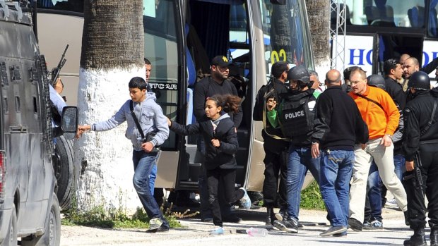 Tourists and visitors from the Bardo museum are evacuated in Tunis after gunmen opened fire.
