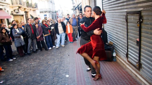 Dancers perform a tango at San Telmo market, Buenos Aires.