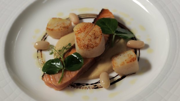Seared scallop and sugar cured ocean trout with hommus, white beans, baby nasturtium, balsamic reduction.