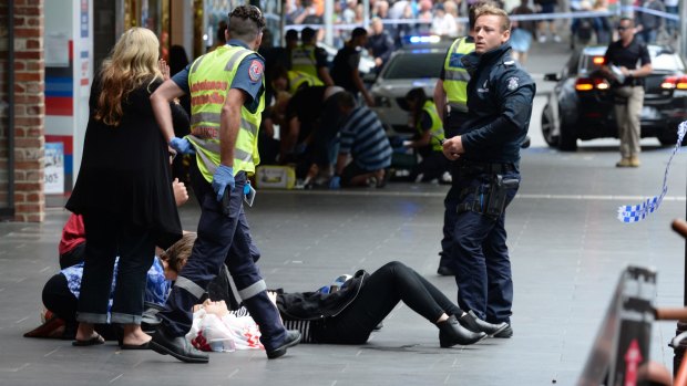 Police and paramedics with an injured pedestrian