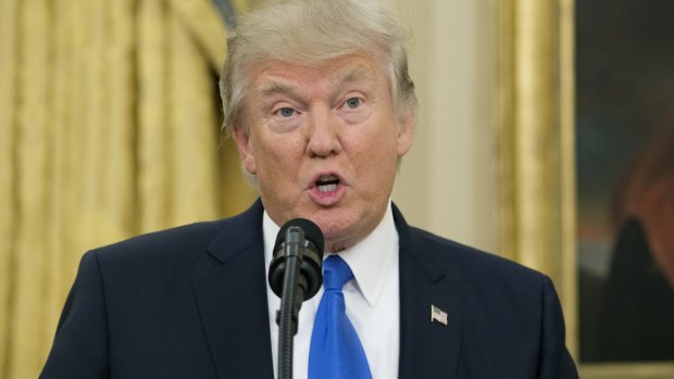 Donald Trump speaks in the Oval Office of the White House on February 1.