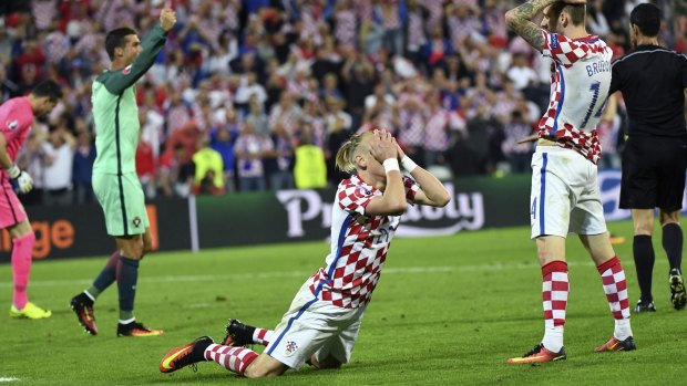 Devastation: Croatia's Domagoj Vida reacts at the end of the Euro 2016 round of 16 match between Croatia and Portugal at Lens.