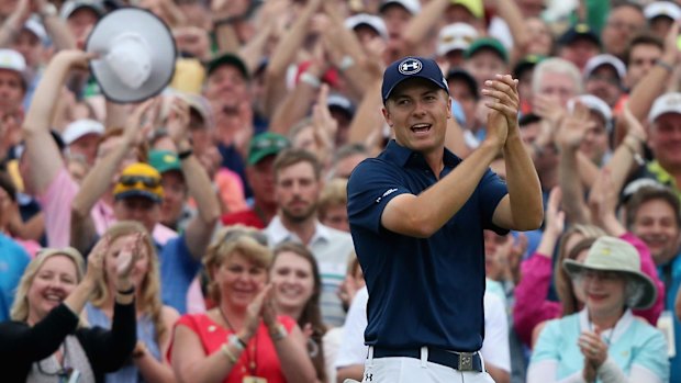 Jordan Spieth celebrates on the 18th green after his victory.