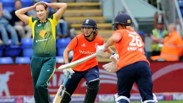 Australia's Ellyse Perry (left) reacts as England's Natalie Sciver and Katherine Brunt steal a sharp single.