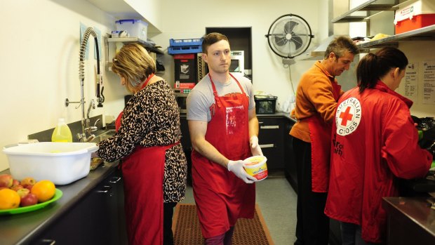The Red Cross which prepares meals for the people of Canberra in need at the Griffith Centre in Civic. From left, volunteers,  Leanne Spiteri, Jonathan Coe, Raymond Spiteri and liaison worker Tracey Crowther  prepare the food.