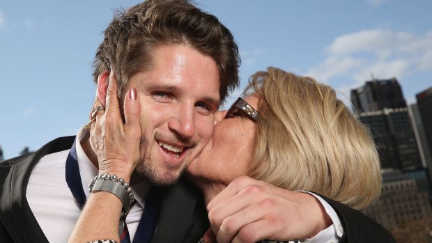 He’s risen: Melbourne’s Jesse Hogan gets a congratulatory kiss from mum Julie after being named the 2015 AFL Rising Star at Crown Palladium on Wednesday. 