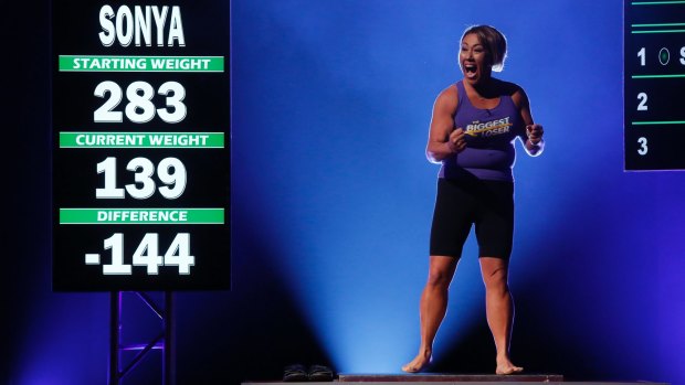 A contestant celebrates her weight loss on the most recent season finale of <i>The Biggest Loser</i> US.