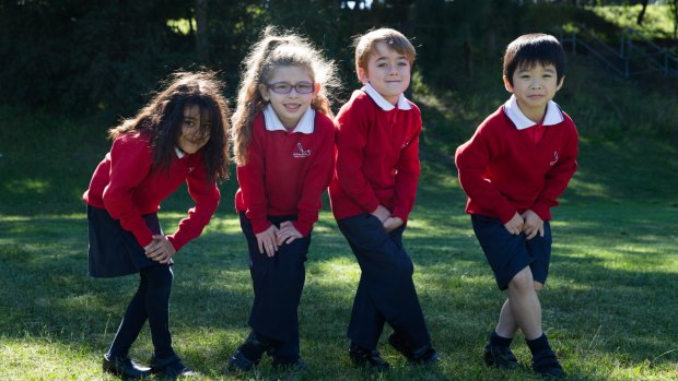 Desperate dash: Rydalmere Public School students, left to right, Husna Omarzai, Arabella Gharib, Gabriel Britz and James Moore, have to run 400 metres from their oval to the nearest toilet block.