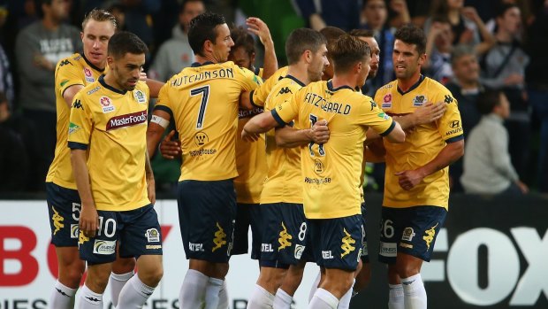 The Mariners gather together after taking the lead against Melbourne Victory in Friday's match.