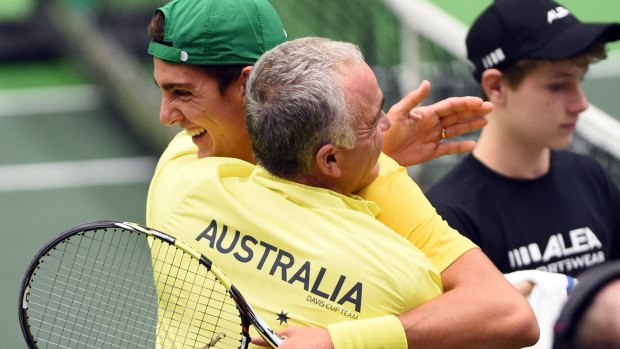 A touch of the Hewitt grit: Wally Masur congratulates Thanasi Kokkinakis after his Davis Cup win.