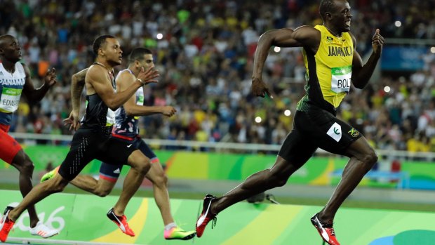 Usain Bolt from Jamaica leads to win the gold medal in the men's 200m final. 