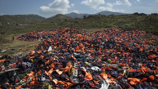 Discarded life vests litter a valley in Mithymna, Greece. 