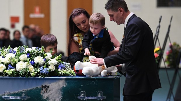 Senior Constable Brett Forte is farewelled by his family and children.