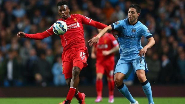 Liverpool announce its away kit in Brisbane on July 16. Daniel Sturridge, left, wears the home kit against Manchester City