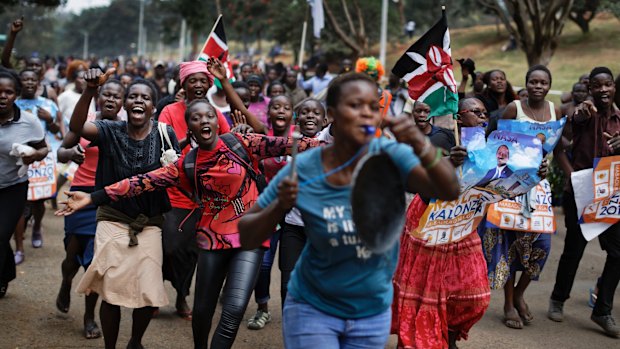 Supporters of opposition leader Raila Odinga celebrate in Uhuru Park, some carrying Kenyan flags and posters of Odinga, as they celebrate after hearing the verdict in Nairobi, Kenya on September 1, 2017. 