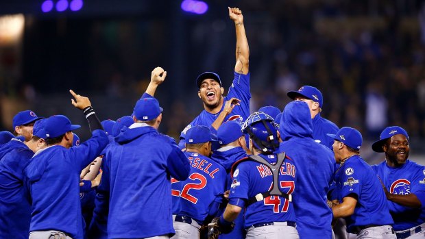 The Chicago Cubs celebrate defeating the Pittsburgh Pirates.