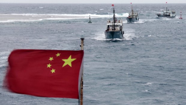 Chinese fishing vessels near the disputed Meiji reef in the South China Sea in July 2012. 