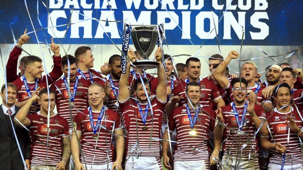World champions: Wigan celebrate the famous victory over the Cronulla Sharks in February.