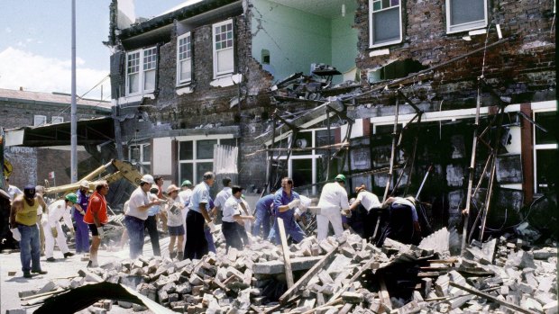 Rescue crews working to find people trapped under rubble beneath the Kent hotel awning, in Hamilton, after the Newcastle earthquake.