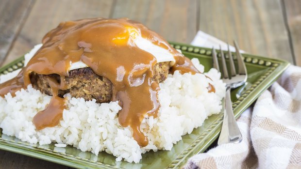 Loco Moco, a traditional Hawaiian dish of teriyaki flavored ground beef patty and a fried egg on a bed of rice, smothered in gravy.