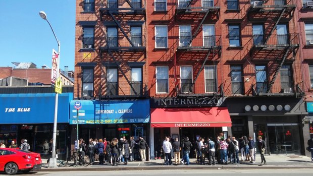 Crowds of millennials wait to be seated for brunch outside the popular Intermezzo restaurant in the Chelsea neighbourhood of New York.