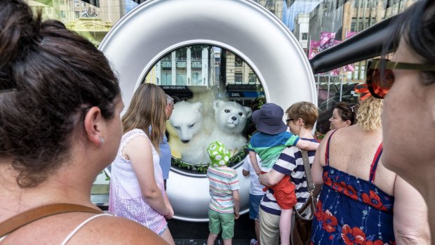 Children watch the Myer Christmas windows in Melbourne.