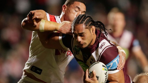 Blockbuster:  Martin Taupau of the Sea Eagles is tackled by Tyson Frizell when the teams met in July last year at Brookvale Oval.