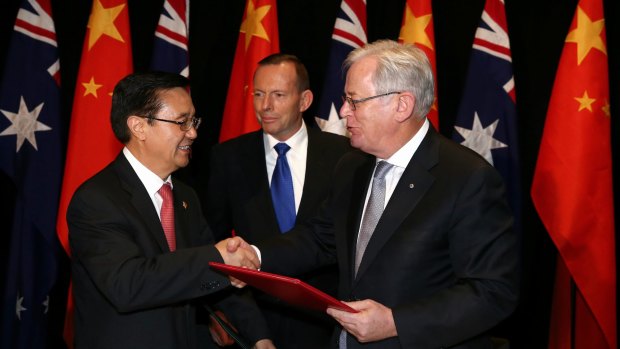 Chinese Commerce Minister Gao Hucheng, former prime minister Tony Abbott and then trade minister Andrew Robb at the signing of the China-Australia free trade agreement in June 2015. 