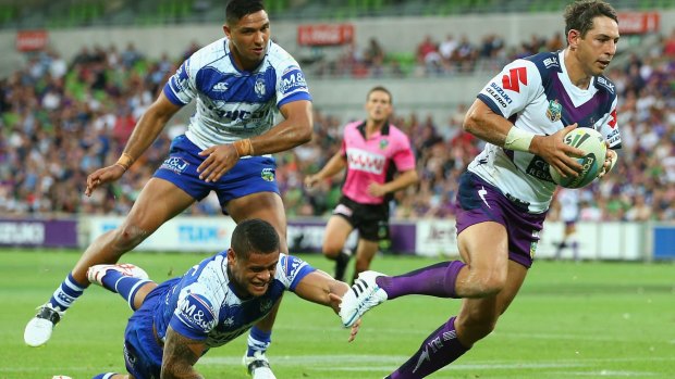 Billy Slater of the Storm breaks through a tackle during the trial match against the Canterbury Bulldogs on Saturday.