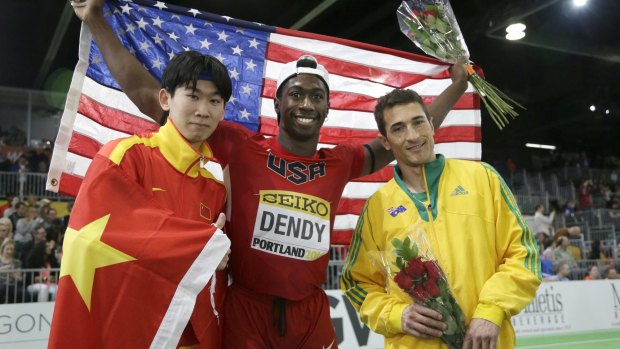 Marquis Dendy, centre, celebrates with China's Huang Changzhou and Australia's Fabrice Lapierre.