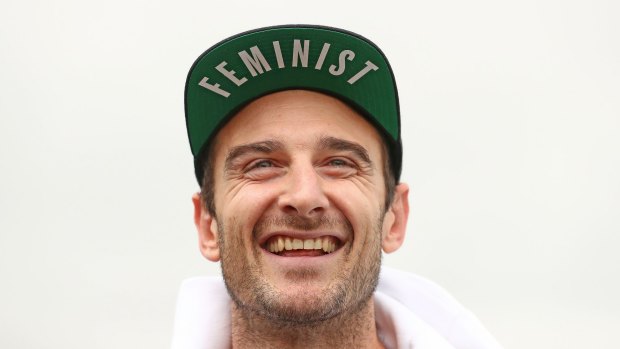 Jobe Watson was all smiles as he spoke to the media, sporting his FEMINIST hat. 