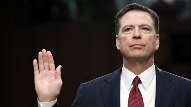 Fired FBI director James Comey is sworn in during a Senate Intelligence Committee hearing on Capitol Hill in June.