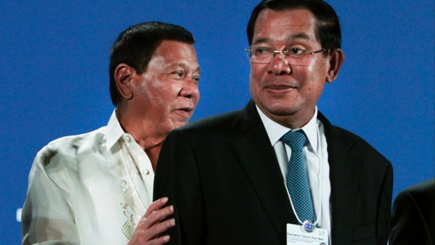 Cambodian Prime Minister Hun Sen, right, seen here with Philippine President Rodrigo Duterte, has resisted widening the scope of the Khmer Rouge tribunal. 