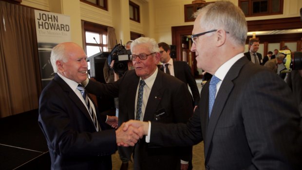 Former Menzies minister Tom Hughes (centre), who gave the Sir Garfield Barwick address in 2011, with his son-in-law, Communications Minister Malcolm Turnbull (right) and former Liberal prime minister John Howard.