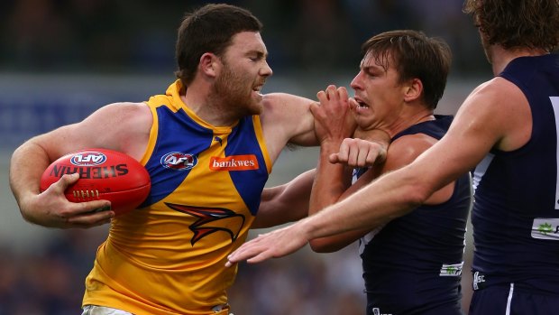Fend off: West Coast's Jeremy McGovern clashes with Nick Suban.